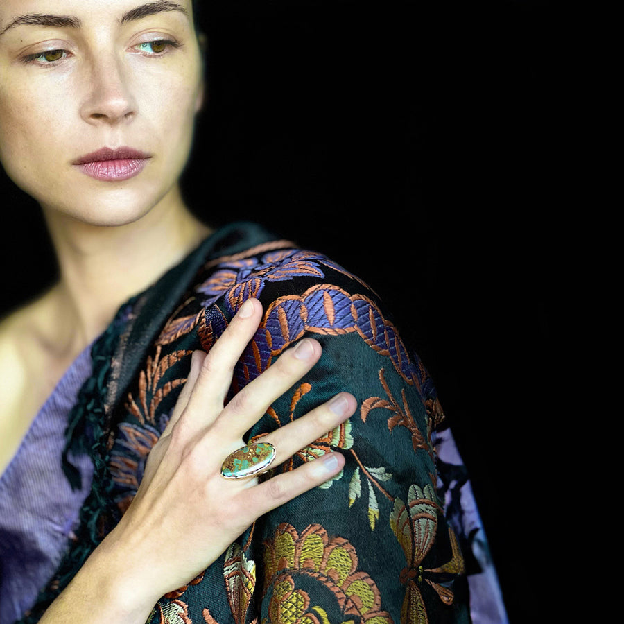 Model's hand displaying KMJ Archipelago Ring on her ring finger