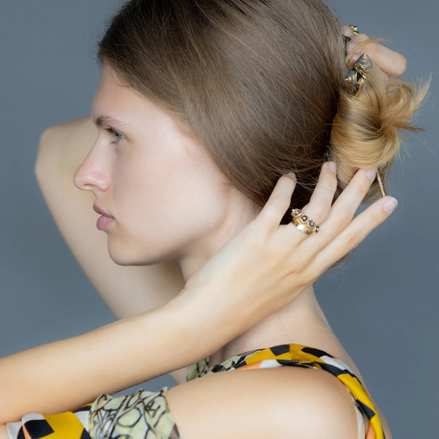 Model wearing KMJ Hair Sticks
